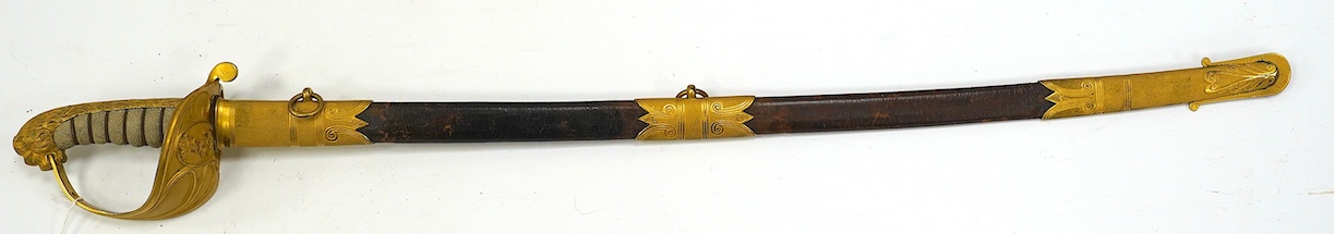 An East India Company naval officer's sword, blade by H. Wart, etched with East India Company device and foliage, regulation gilt, brass hilt with EIC device, white fish skin covered grip, in its leather scabbard with gi